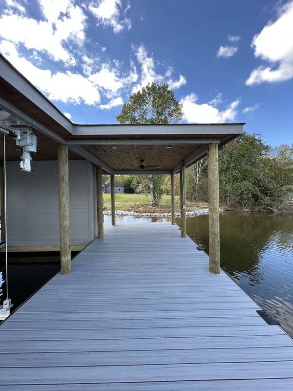 Side view of the covered dock walkway and roofline over the water