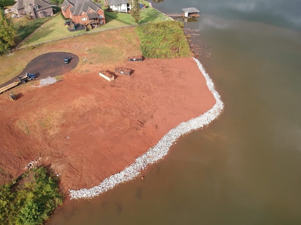 Aerial view of finished rip rap shoreline stabilization curving along a lakefront lot on Fort Loudoun Lake in Knoxville, TN