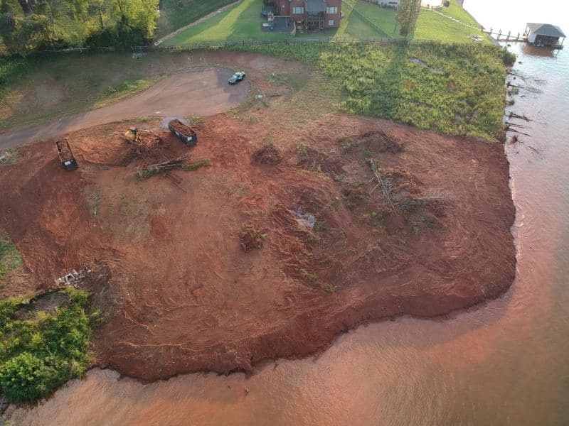 Aerial view of the cleared and graded lakefront lot before rip rap shoreline stabilization was placed