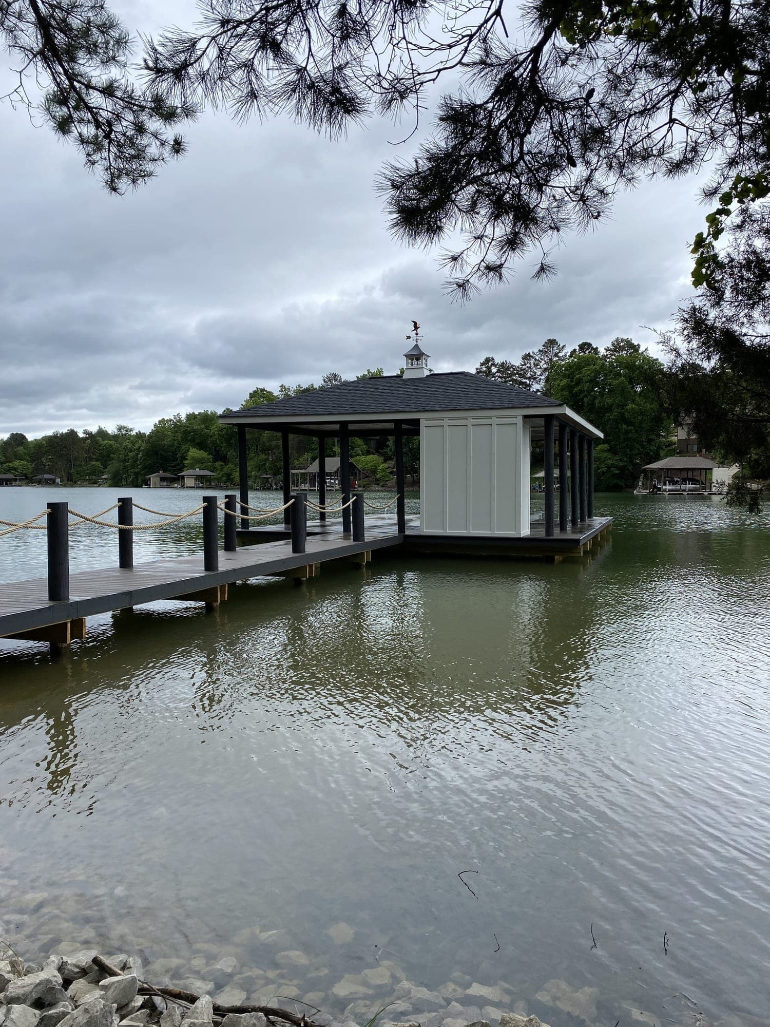 Covered boat dock with a cupola roof and enclosed storage room on Tellico Lake in Tellico Village, Loudon, TN