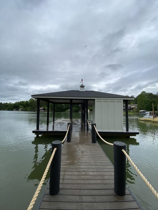 Front view of the covered dock and storage room at the end of the walkway