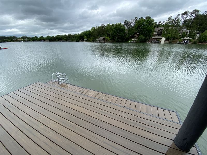 Composite decking at the edge of the dock looking out over the lake
