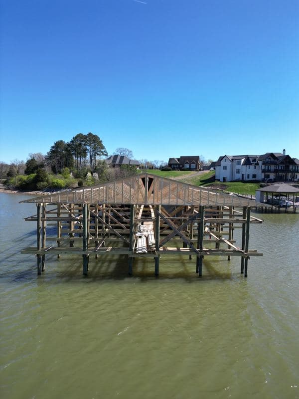 Front view of marina extension framing on pilings during construction