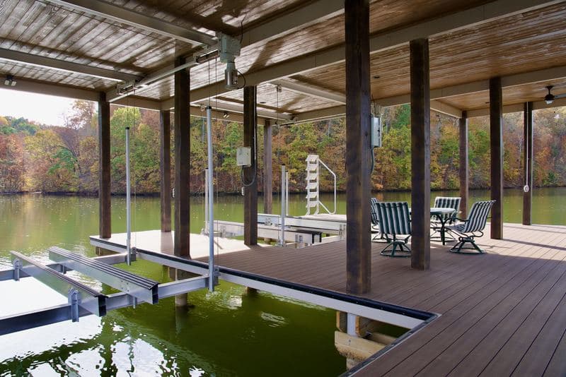 Under the covered dock roof: decking, slips, and seating overlooking the lake