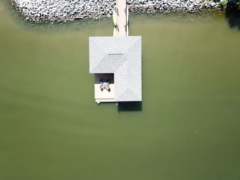 Top-down aerial of the dock roof and walkway over the water
